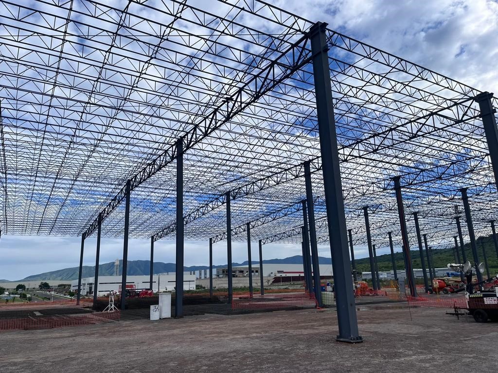 Open web roof joists spanning steel columns on a building frame